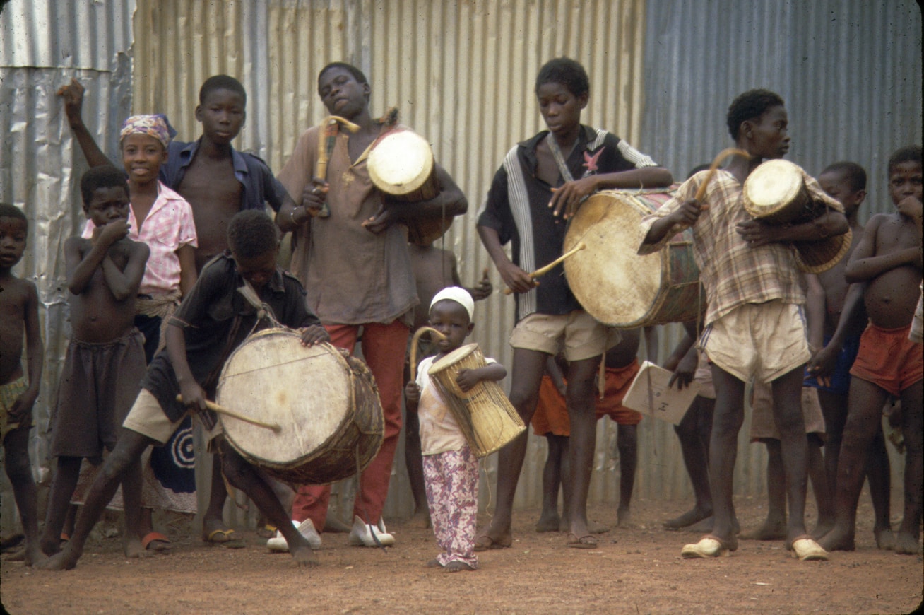 young boys drumming Takai